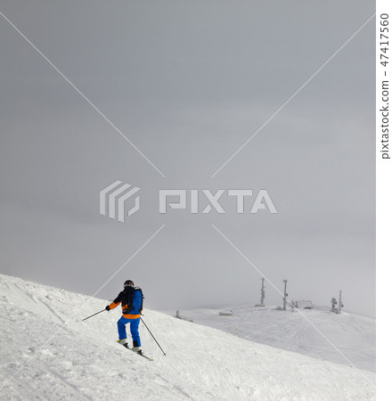 Skier before downhill on slope for freeriding Skier before downhill on slope for freeriding 47417560