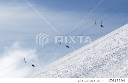 Snowy off-piste ski slope with traces from skis Snowy off-piste ski slope with traces from skis 47417594