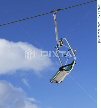Ski lift and blue sky with clouds at winter day Ski lift and blue sky with clouds at winter day 47417605