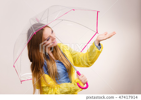 Woman in rainproof coat with umbrella. Forecasting Woman in rainproof coat with umbrella. Forecasting 47417914