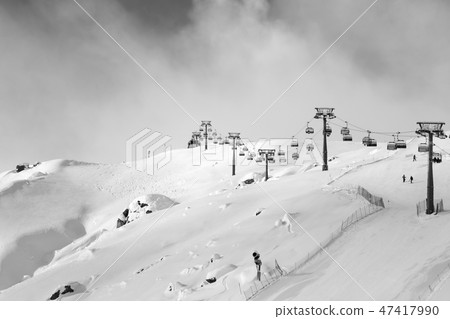 Snow ski slope and skilift at ski resort at winter Snow ski slope and skilift at ski resort at winter 47417990