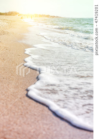 waves on the sandy shore 47419201