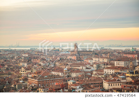 Venice Street of Venezia stained in the sunset overlooking the bell tower of Saint Mark's Square 47419564