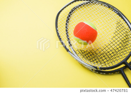 Tennis Ball and rackets on yellow Background,  47420781