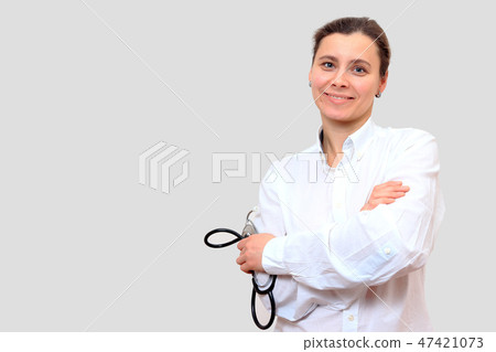 Smiling female doctor therapist with stethoscope. Smiling female doctor therapist with stethoscope. 47421073