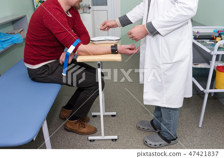 Preparation for blood test. Medical technician preparing before taking a blood sample from patient. Preparation for blood test. Medical technician preparing before taking a blood sample from patient. 47421837