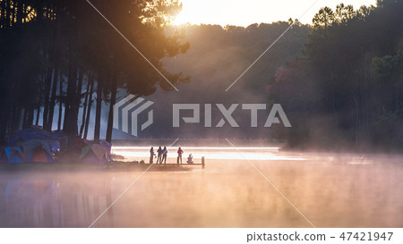 Silhouette of tourist enjoying at Pang Ung Silhouette of tourist enjoying at Pang Ung 47421947