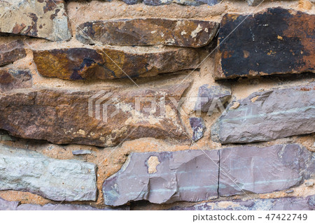 old wall masonry with different sizes smeared joints 47422749