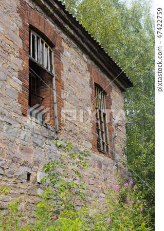 abandoned building with no windows, with bars on the windows abandoned building with no windows, with bars on the windows 47422759