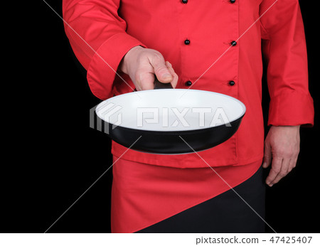 cook holding an empty round white frying pan cook holding an empty round white frying pan 47425407
