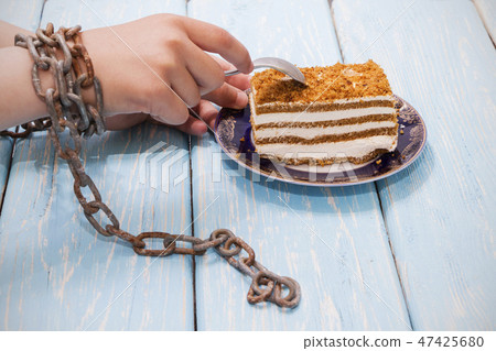 girl eating delicious cake girl eating delicious cake 47425680