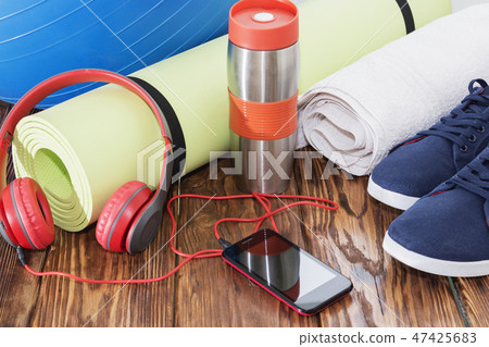 Fit ball, yoga mat, and water bottle close up Fit ball, yoga mat, and water bottle close up 47425683