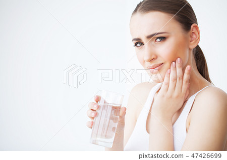Tooth Pain. Woman Feeling Tooth Pain. Closeup Of Beautiful Sad Girl Suffering From Strong Tooth Pain 47426699