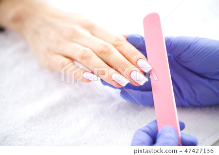 SPA manicure. French manicure at spa salon. Woman hands in a nail salon receiving a manicure 47427136