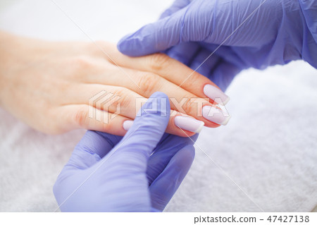 SPA manicure. French manicure at spa salon. Woman hands in a nail salon receiving a manicure 47427138