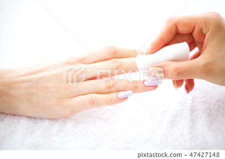SPA manicure. French manicure at spa salon. Woman hands in a nail salon receiving a manicure SPA manicure. French manicure at spa salon. Woman hands in a nail salon receiving a manicure 47427148