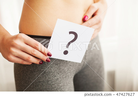Health. Woman Body In Underwear With Question Card Near Belly 47427627