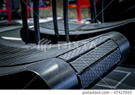 Treadmill in gym interior. Fitness club with equipment. Sports background 47427693