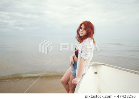 pretty girl in a beach 47428256