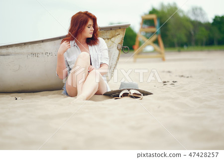 pretty girl in a beach 47428257