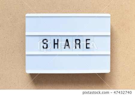 White lightbox with word share on wood background White lightbox with word share on wood background 47432740