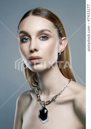 jewelry on beautiful girl. young blonde woman 47433277