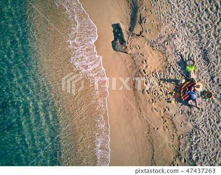 Beautiful beach with family top view shot 47437263