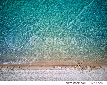 Beautiful beach with family drone shot Beautiful beach with family drone shot 47437265