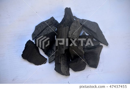 Charcoal on the white floor. Charcoal on the white floor. 47437455