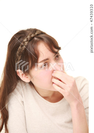 A woman with mixed smell troubled with bad smell A woman with mixed smell troubled with bad smell 47439310