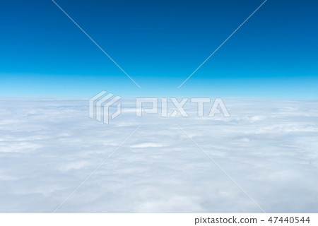 Azure sky horizon seen from airplane window 47440544
