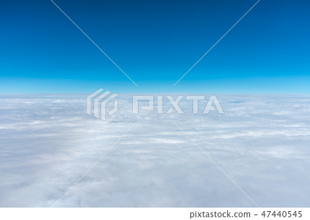 Azure sky horizon seen from airplane window 47440545