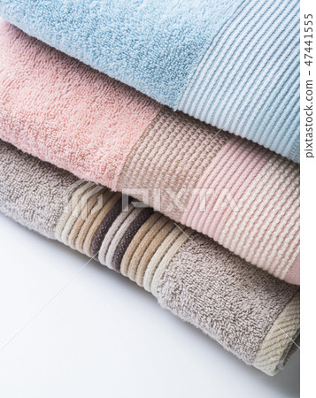 Pastel color clean folded towels on white Pastel color clean folded towels on white 47441555