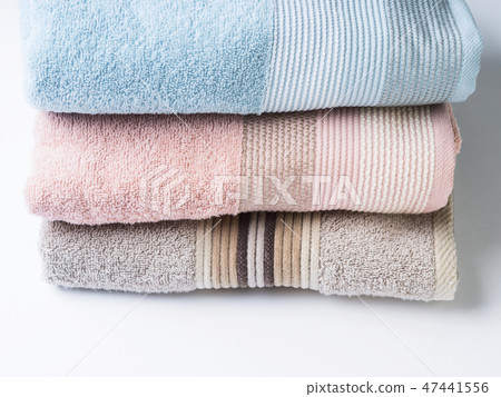 Pastel color clean folded towels on white Pastel color clean folded towels on white 47441556