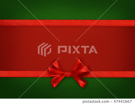 Silk ribbon and a bow on red and green paper Silk ribbon and a bow on red and green paper 47441667