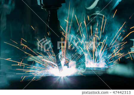 Team industrial robot are welding in factory 47442313