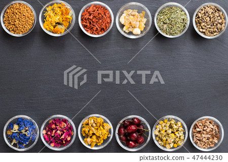 Selection of dried herbs on a dark background Selection of dried herbs on a dark background 47444230