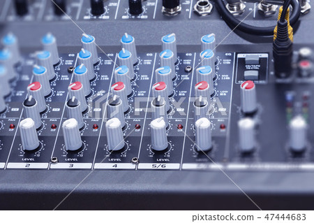 audio jack and wires connected to audio mixer 47444683