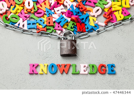 Closed secret knowledge. Letters of information symbol wrapped in chain and locked. Closed secret knowledge. Letters of information symbol wrapped in chain and locked. 47446344