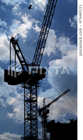 Cranes on a construction site. Industrial image Cranes on a construction site. Industrial image 47446531