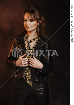 Sexy young girl sitting on bar stool Sexy young girl sitting on bar stool 47447955