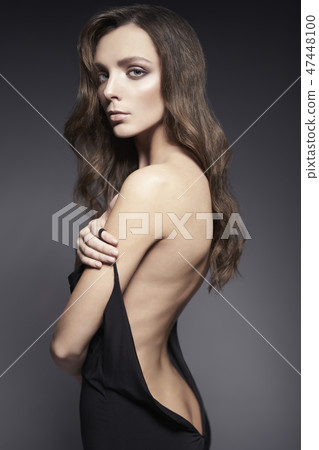 Fashion photo of beautiful lady in black dress. 47448100