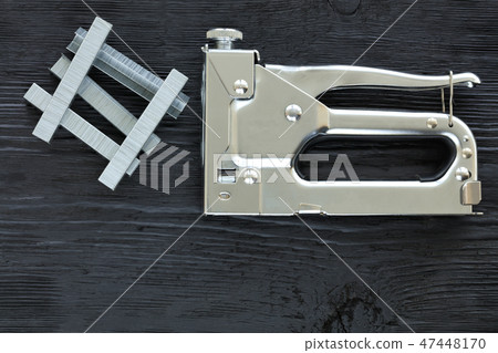 Metal industrial chrome stapler gun and staples Metal industrial chrome stapler gun and staples 47448170
