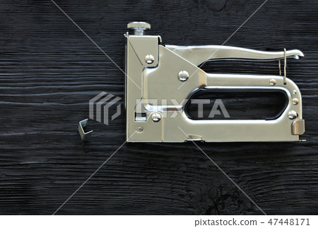 Metal industrial chrome stapler gun and staples Metal industrial chrome stapler gun and staples 47448171
