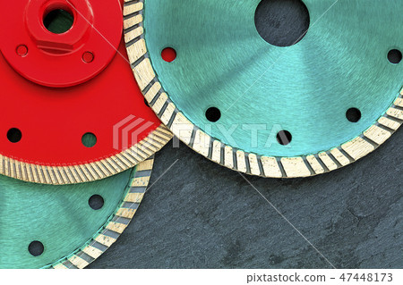 Several diamond cutting wheels against of granite. 47448173