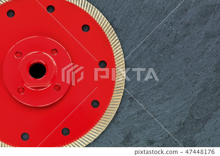 A part of a diamond cutting wheel is red 47448176