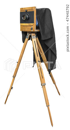 old wooden camera on a tripod isolated on white  47448792