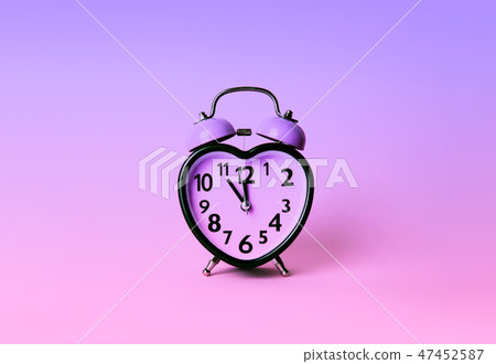 Heart shaped clock on pink background. Heart shaped clock on pink background. 47452587