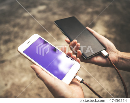 Smartphone charging battery from external power 47456254