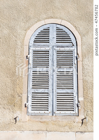 Old ancient window shutters of a mediterranean house, vintage background. 47456782